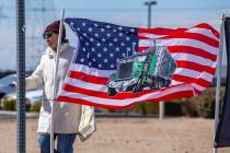 A semi truck on American flag is a popular item for The People’s Convoy as attendees arr ...
