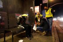 Los Angeles city councilmember Paul Krekorian, third from right, talks to a homeless man during ...