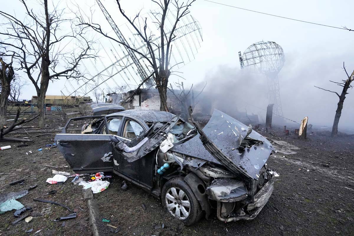 Damaged radar, a vehicle and equipment are seen at a Ukrainian military facility outside Mariup ...