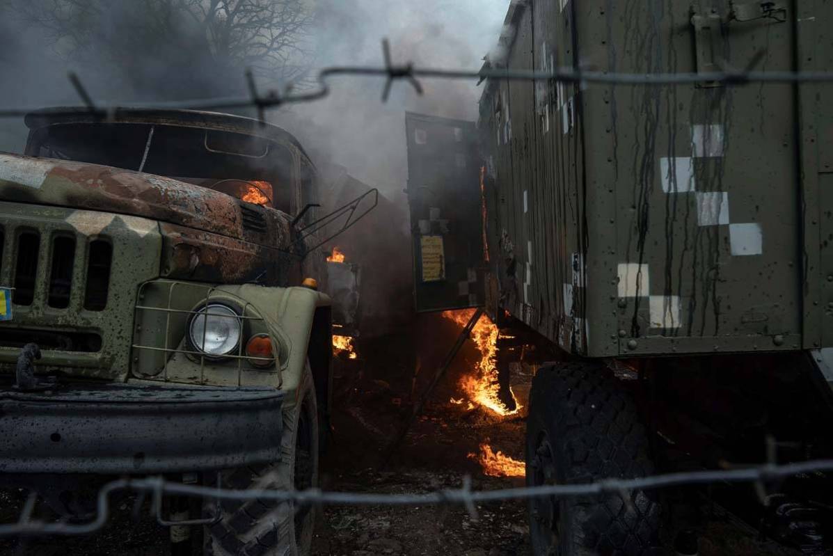 Ukrainian military track burns at an air defence base in the aftermath of an apparent Russian s ...