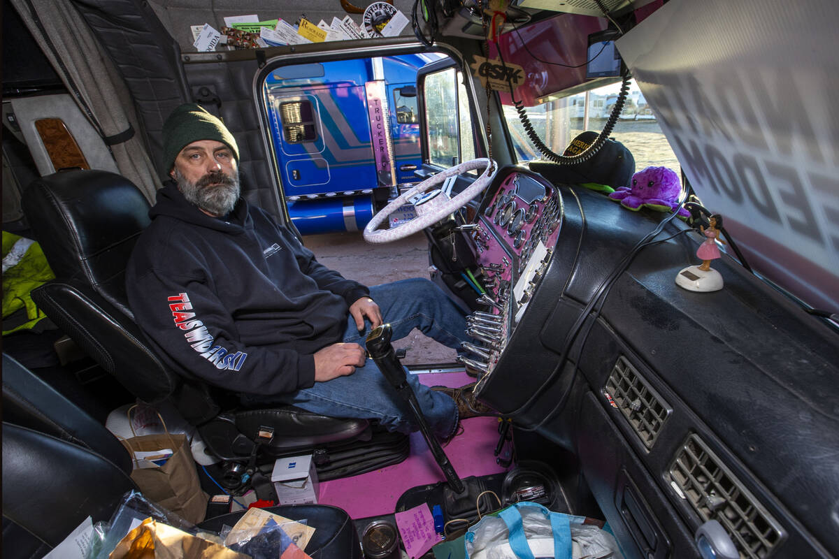 Trucker Art Pflughoeft from Jump River, Wisconsin, sits in the cab of his semi while apart of T ...
