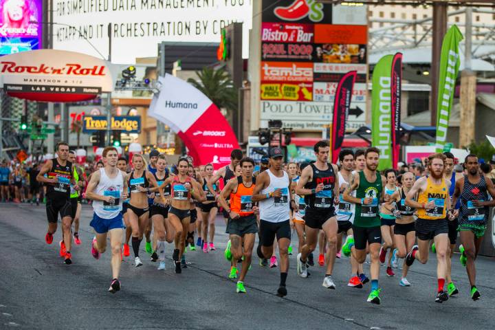 Elite runners leave the starting line during the Las Vegas Rock 'n' Roll Marathon along the Las ...