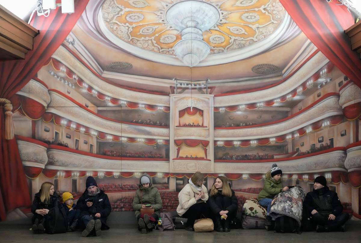 People rest in the Kyiv subway, using it as a shelter in Kyiv, Ukraine, Friday, Feb. 25, 2022. ...