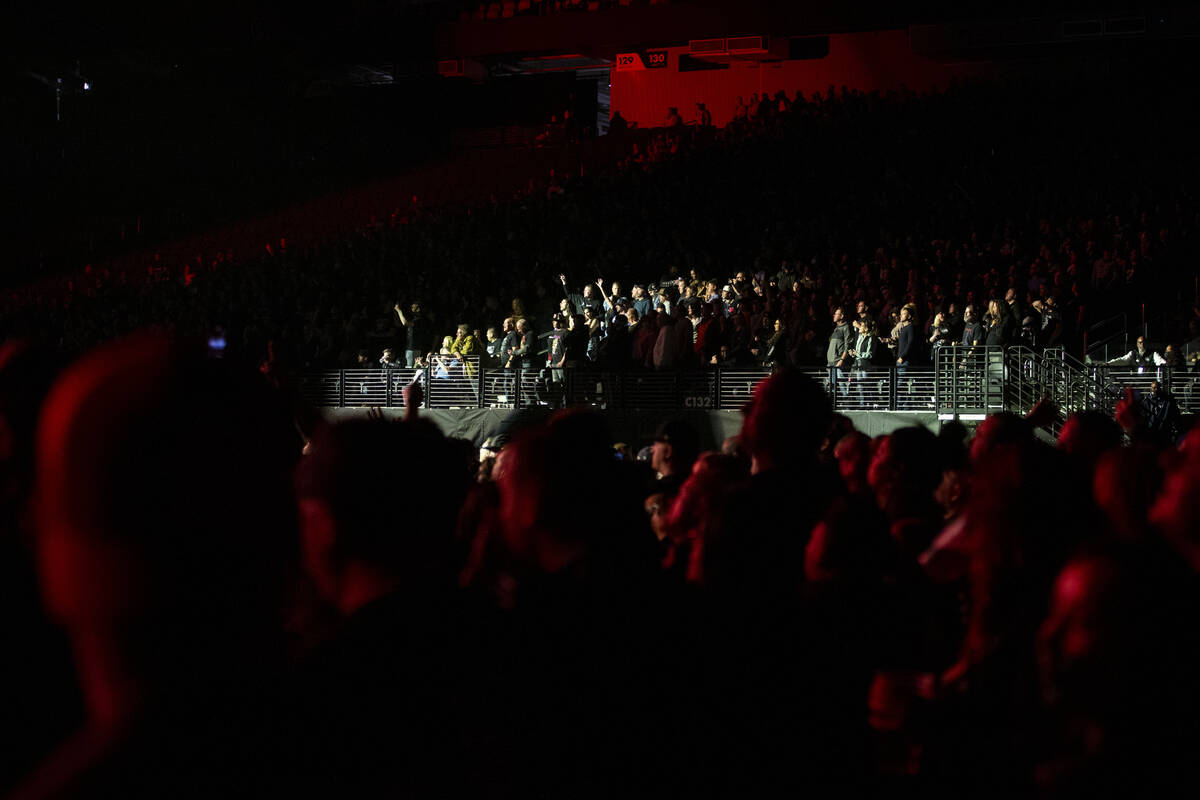 Fans watch Metallica perform in a music concert at Allegiant Stadium in Las Vegas, Friday, Feb. ...