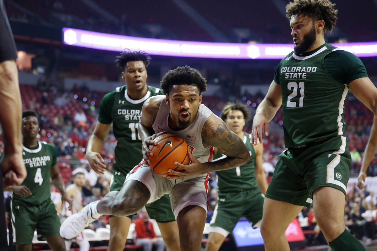 UNLV’s Royce Hamm Jr. (14) grabs a rebound as Colorado State’s Dischon Thomas (11 ...