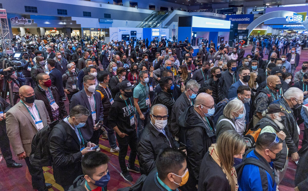 Attendees begin to file into the first day of CES during its opening at the Las Vegas Conventio ...