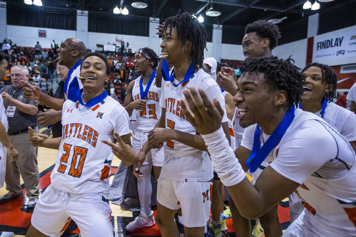 Mojave players celebrate their win over Spring Valley with a final 64-61 following the second h ...