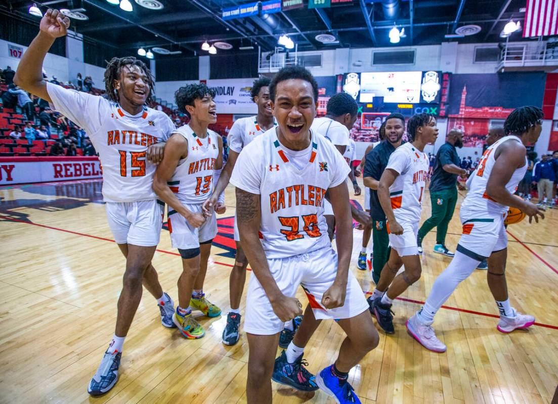 Mojave players celebrate their win over Spring Valley with a final 64-61 following the second h ...