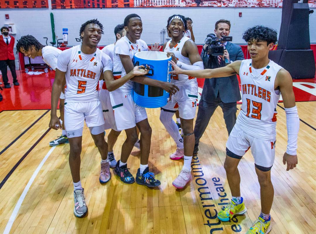 Mojave players pretend to bering over the gatorade as they celebrate their win over Spring Vall ...