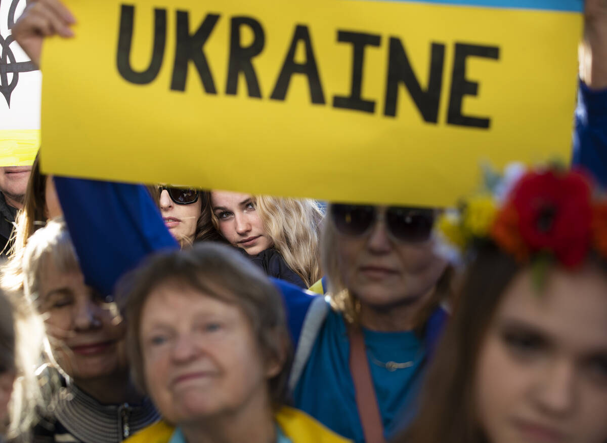 Demonstrators protest the Russian invasion of Ukraine on the Strip on Saturday, Feb. 26, 2022, ...