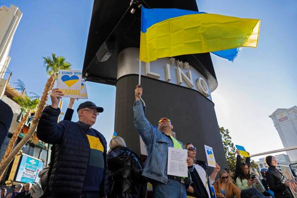 Demonstrators protest the Russian invasion of Ukraine on the Strip on Saturday, Feb. 26, 2022, ...