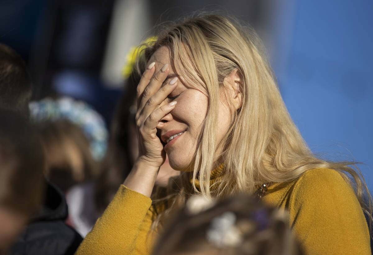 Mariana Sombil wipes tears from her eyes during a protest of the Russian invasion of Ukraine on ...