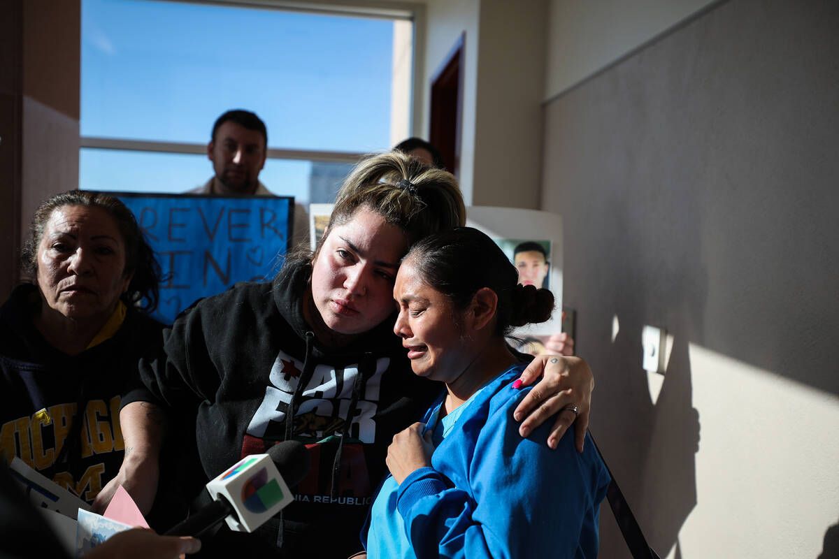 Annissa Abina, aunt to Mason Dominguez, comforts family friend Clarissa Canacho as she speaks t ...