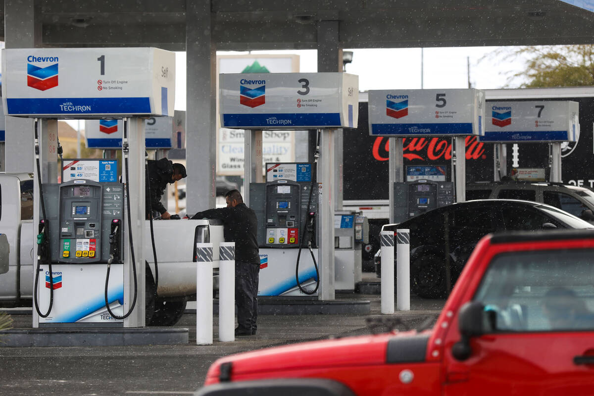 Customers fill their cars with gas at a Shell gas station in Las Vegas on Wednesday, Feb. 23, 2 ...