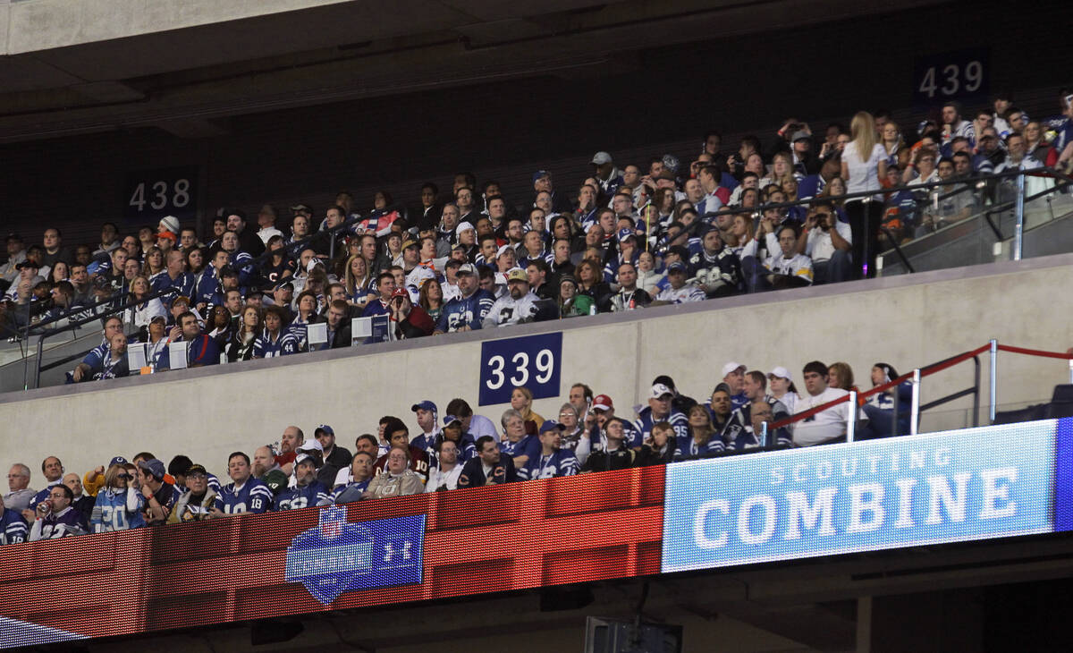 FILE - A group of fans watch during the NFL football scouting combine as quarterbacks, wide rec ...