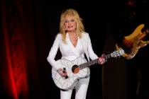 FILE - Dolly Parton performs in concert on July 31, 2015, in Nashville, Tenn. Parton is among t ...