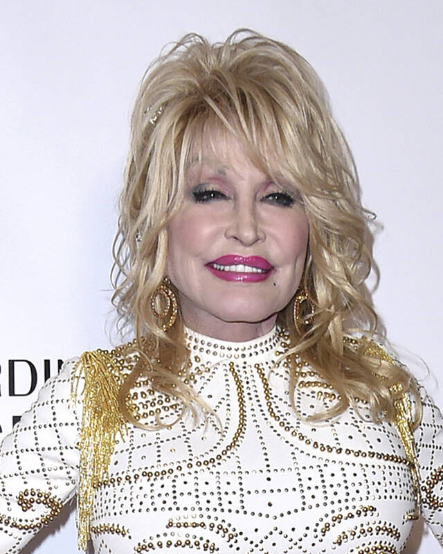 FILE - Dolly Parton arrives at MusiCares Person of the Year in her honor on Feb. 8, 2019, in Lo ...
