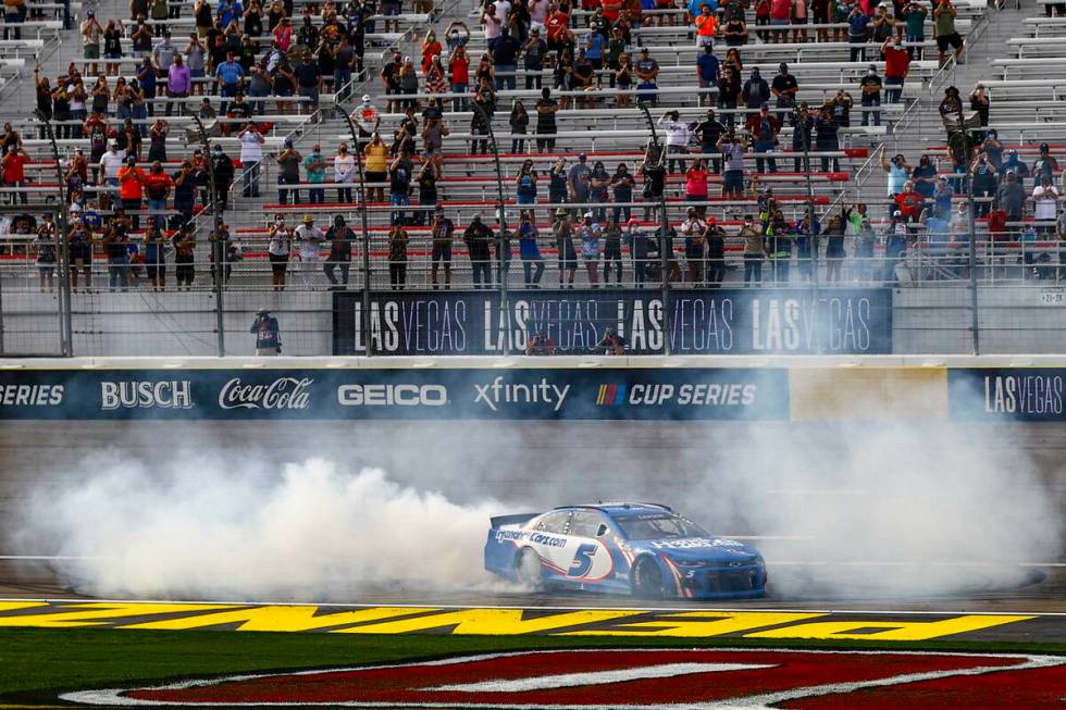 Kyle Larson does a burnout after winning the NASCAR Cup Series Pennzoil 400 auto race at the La ...