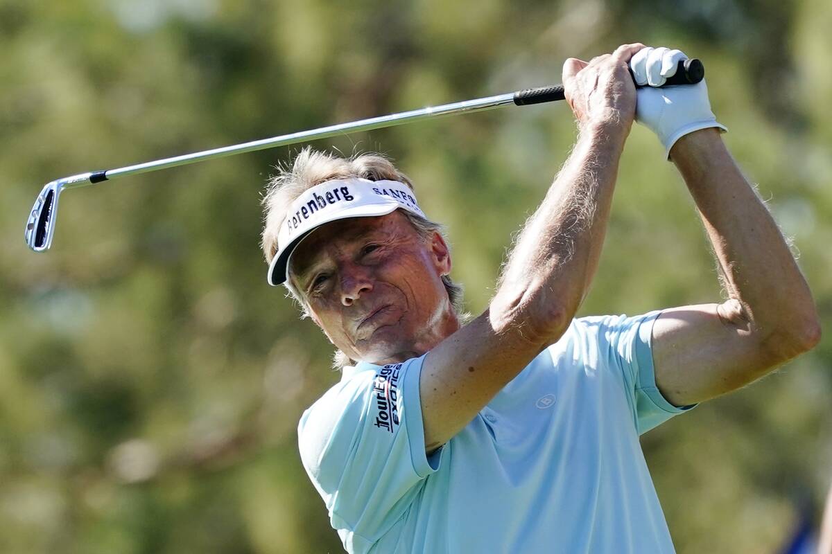 Bernhard Langer, of Germany, hits his tee shot on the eighth hole during the third round of the ...