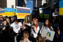 Jenny Arata, right, from Kyiv, Ukraine, leads demonstrators during a protest over the Russian i ...