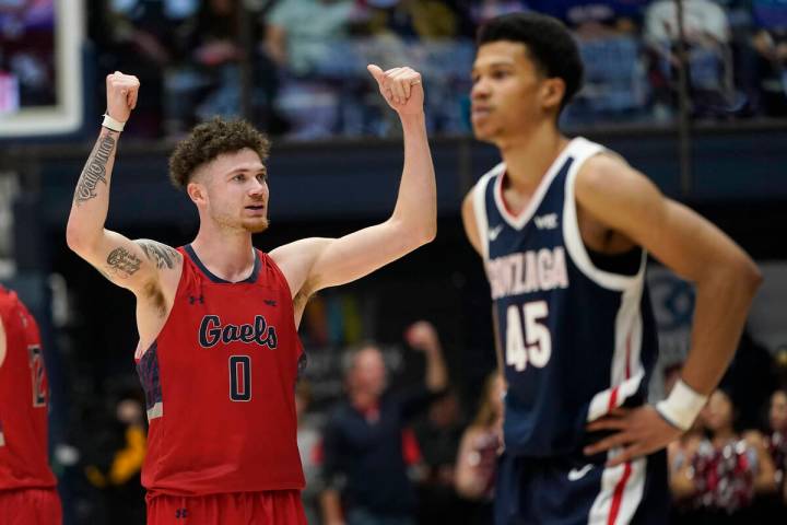 Saint Mary's guard Logan Johnson (0) celebrates near Gonzaga guard Rasir Bolton (45) during the ...