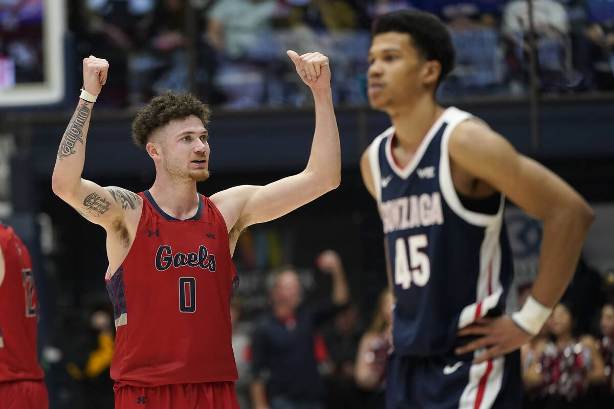 Saint Mary's guard Logan Johnson (0) celebrates near Gonzaga guard Rasir Bolton (45) during the ...