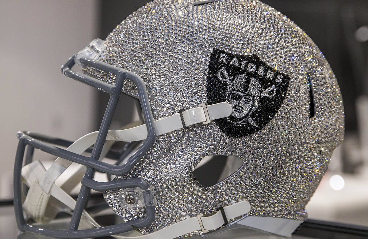 A crystal-covered Raider's helmet for $7,700 is on display at The Raider Image official team st ...