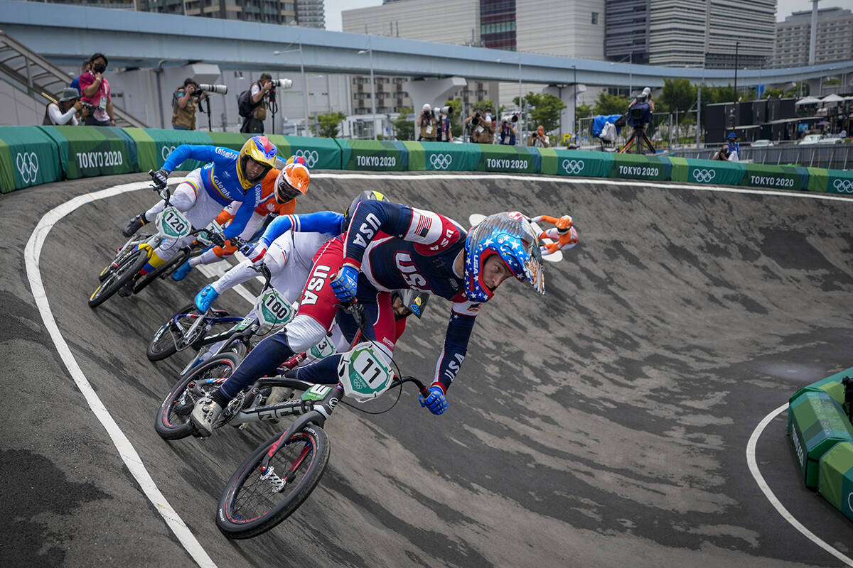 Connor Fields of the United States, center, who later crashed, is followed by Romain Mahieu of ...