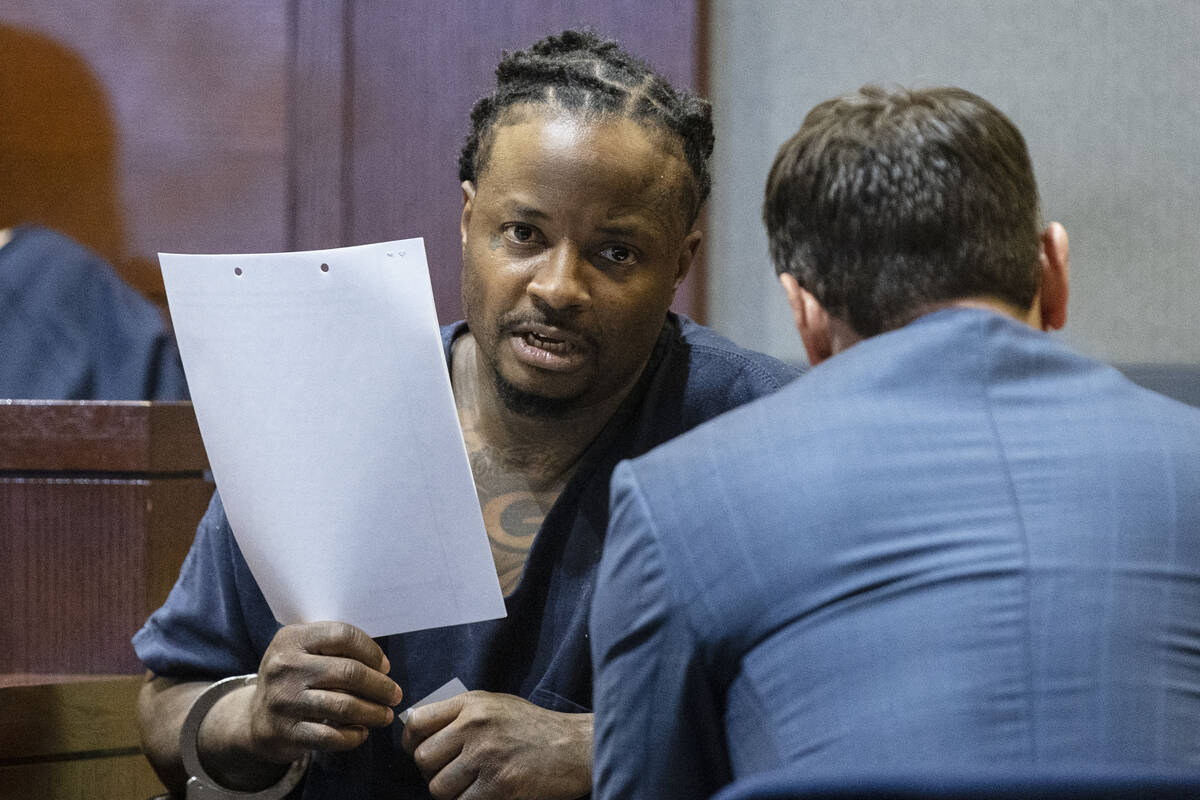 Lee Wilson talks to his attorney, Josh Tomsheck, during his court appearance at the Regional Ju ...