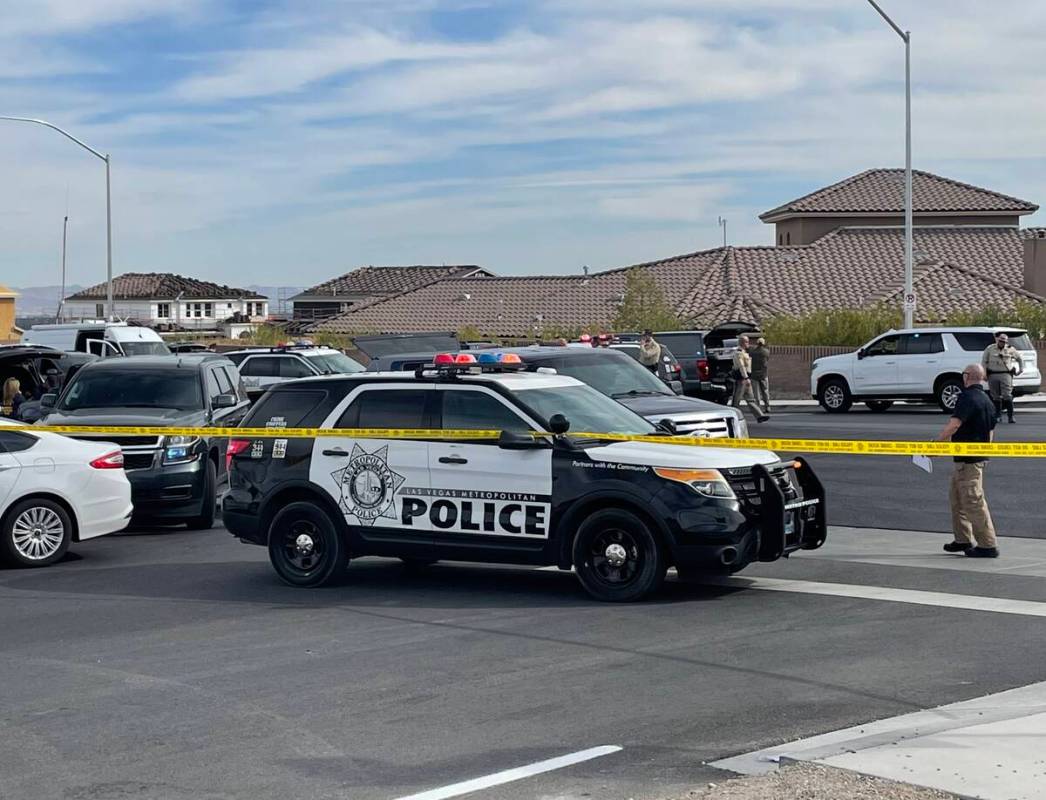 Las Vegas police and the FBI investigate a shooting on the 5000 block of Ruffian Road, near Wes ...