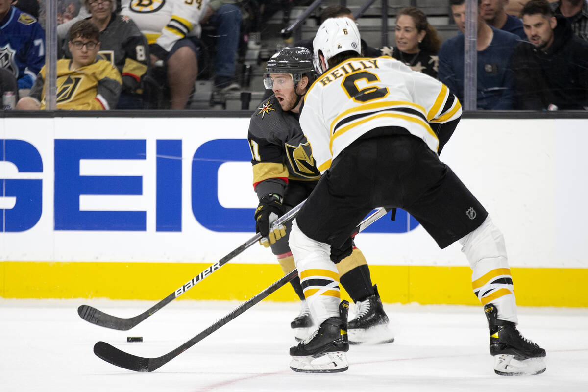 Golden Knights center Jonathan Marchessault (81) skates against Bruins defenseman Mike Reilly ( ...