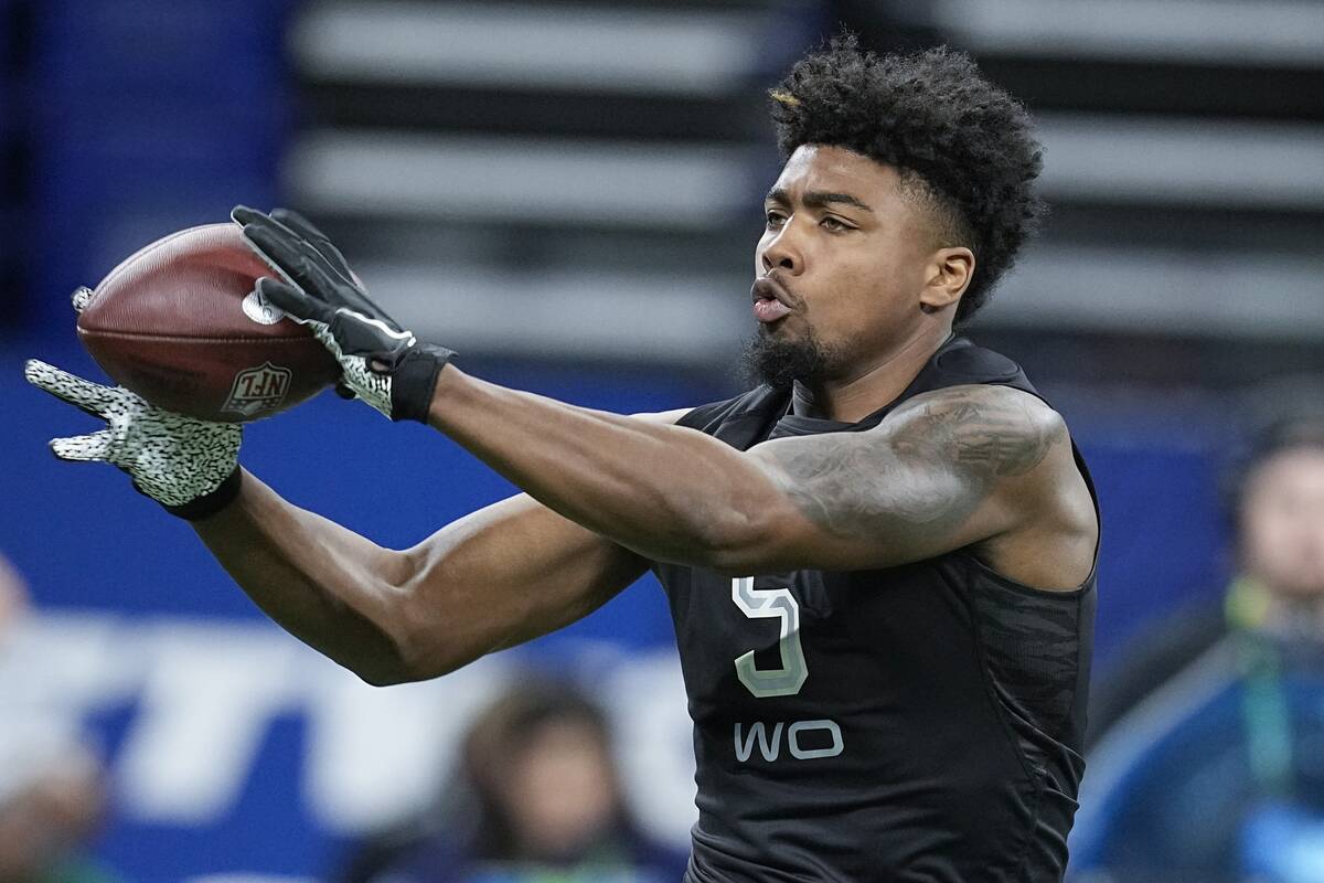 Arkansas wide receiver Treylon Burks runs a drill during the NFL football scouting combine, Thu ...