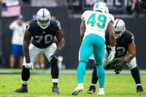 Raiders offensive tackle Alex Leatherwood (70) and Raiders offensive tackle Jermaine Eluemunor ...