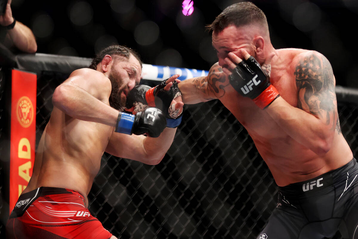 Colby Covington, right, lands a punch against Jorge Masdival in the fourth round of an UFC 272 ...