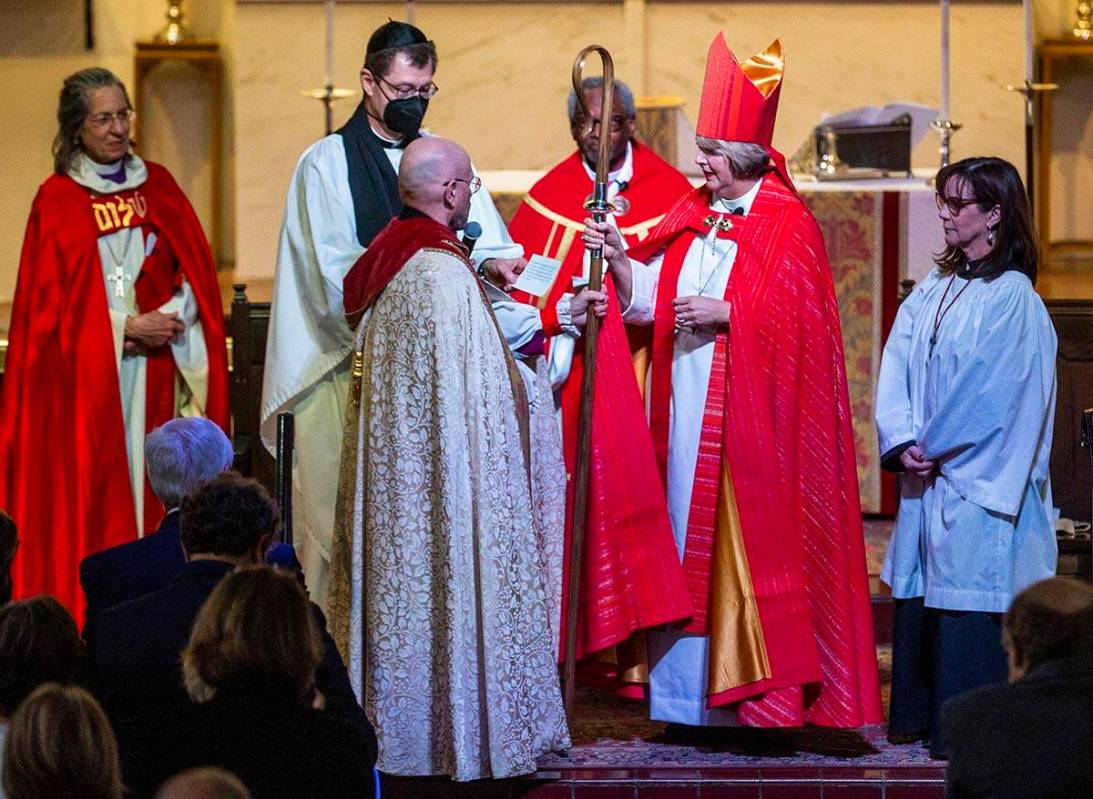 Bishop Elizabeth Bonforte Gardner receives her Bishop’s staff while consecrated the next ...