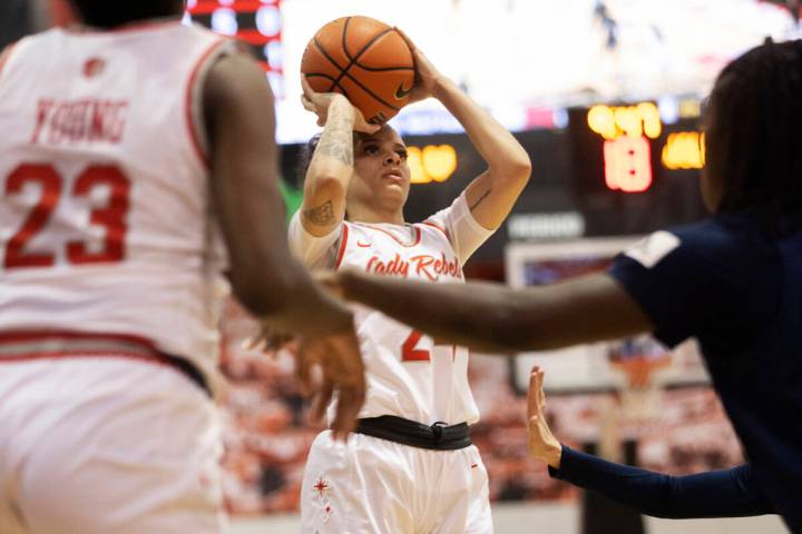 UNLV Lady Rebels guard Essence Booker (24) shoots in the second half during a girls college bas ...