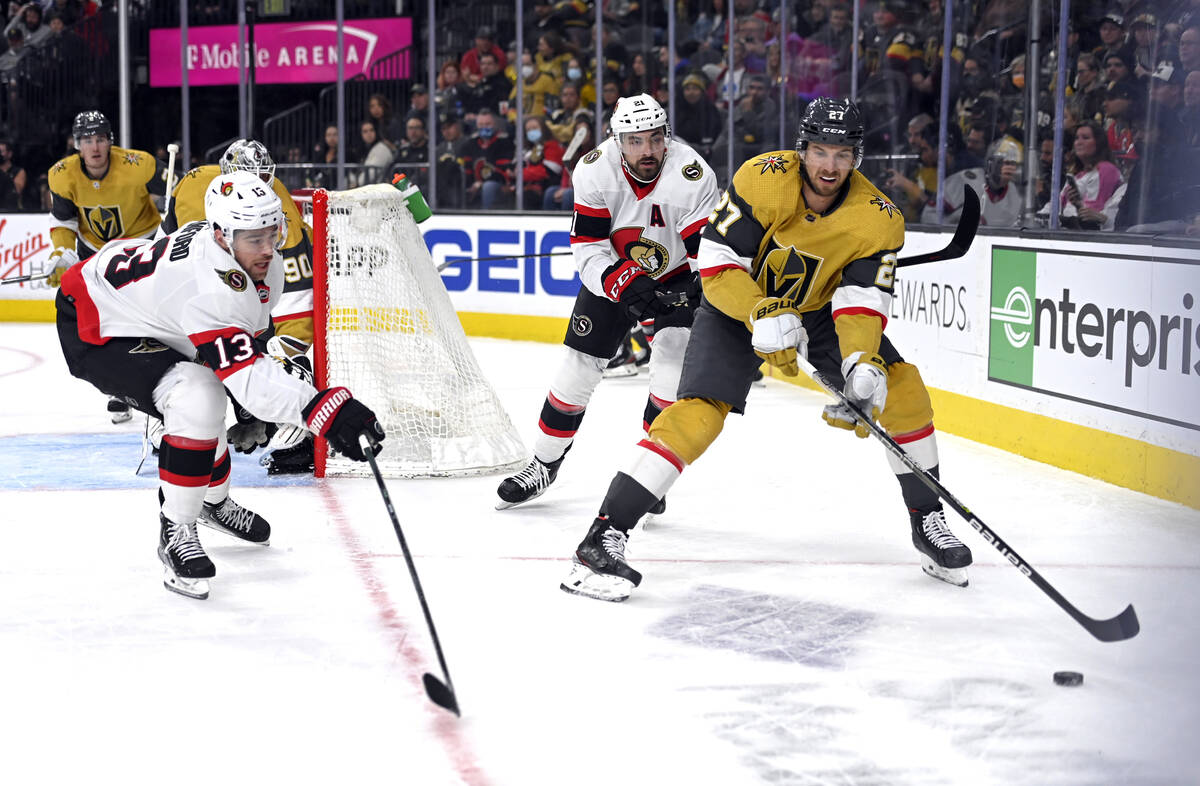 Ottawa Senators left wing Zach Sanford (13) goes to block a pass by Vegas Golden Knights defens ...