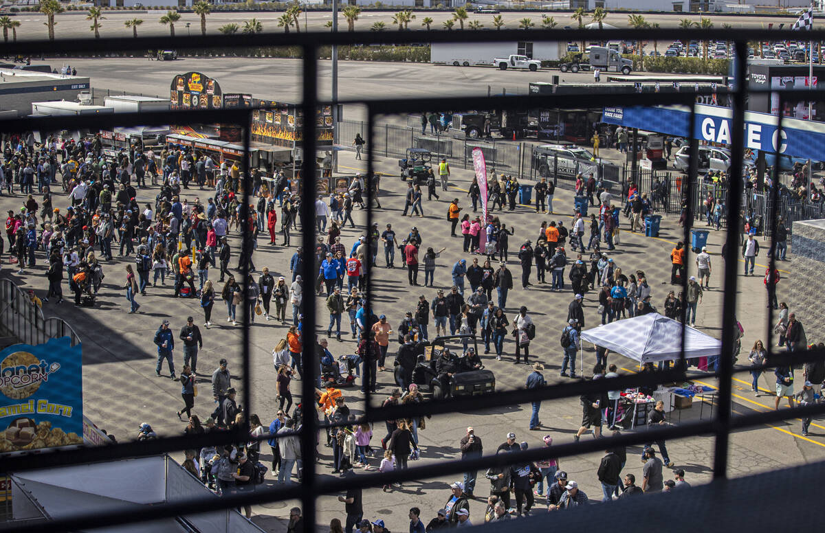 People file into Las Vegas Motor Speedway during the Pennzoil 400 NASCAR Cup Series race on Sat ...