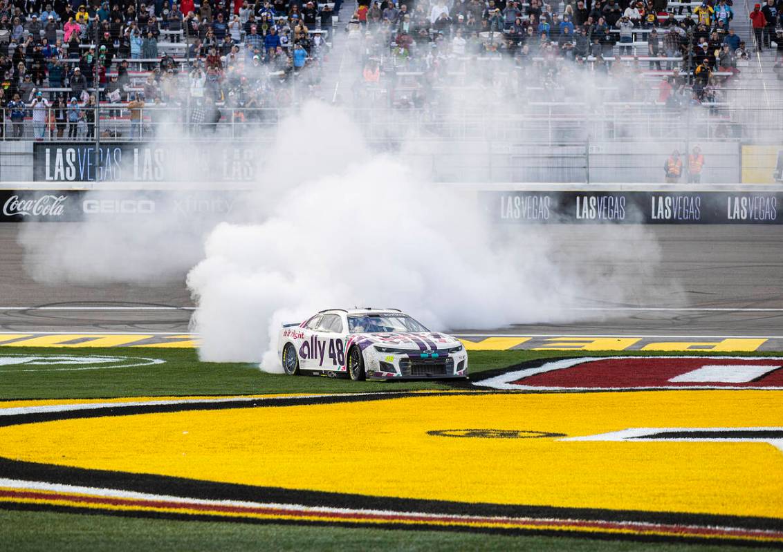 NASCAR Cup Series driver Alex Bowman (48) celebrates with a burn out after winning the Pennzoil ...