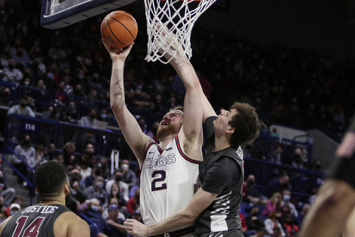 Gonzaga forward Drew Timme (2) shoots while being defended by Santa Clara forward Parker Braun ...