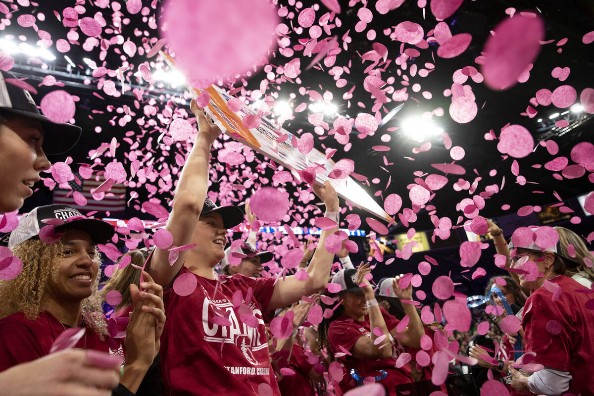 Stanford players including forward Alyssa Jerome, second from left, celebrate after winning an ...