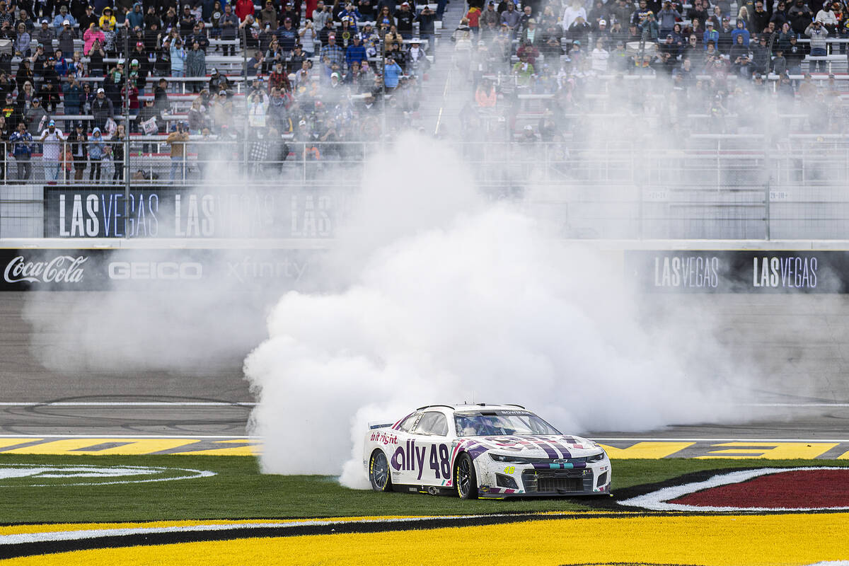 NASCAR Cup Series driver Alex Bowman (48) celebrates with a burn out after winning the Pennzoil ...