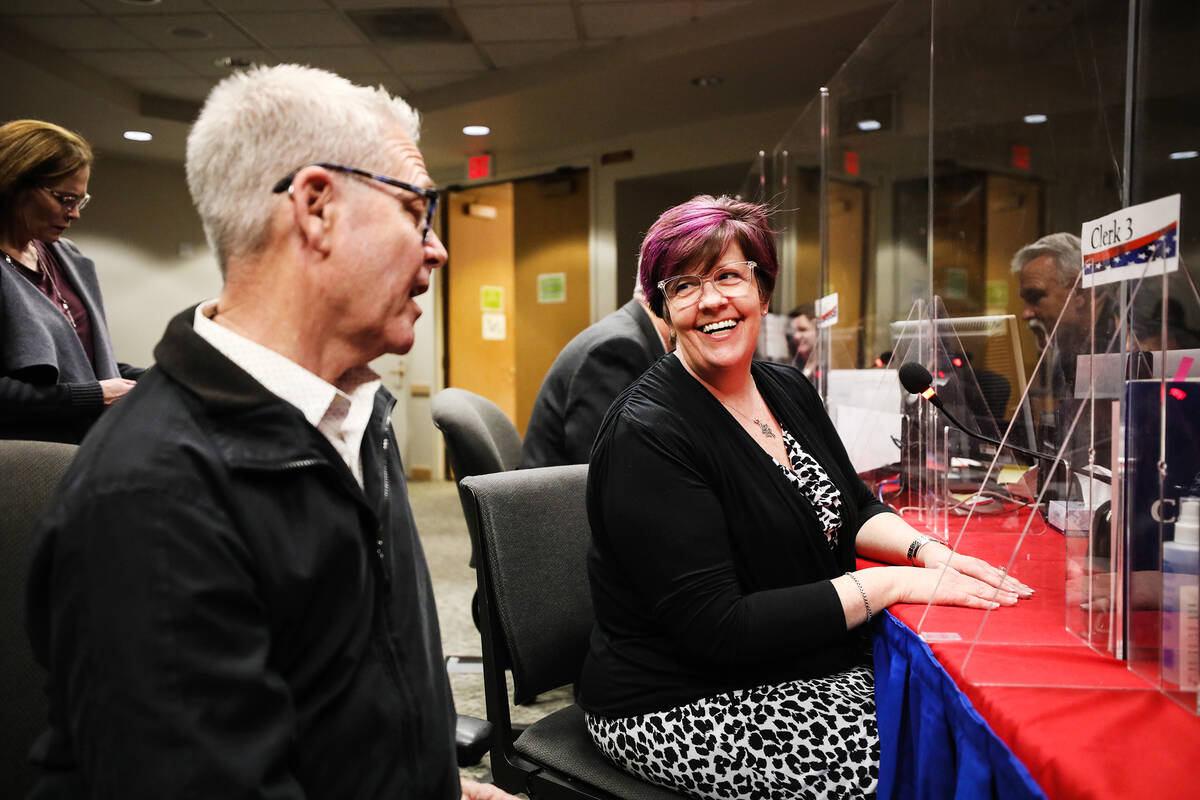 Tracy Brown-May laughs with her husband Jeff May, left, as she files to run for assembly distri ...