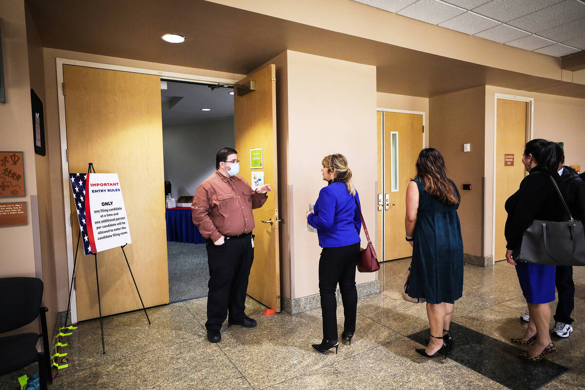 Candidates wait in line to file to run for office for Nevada’s primary election, at the ...