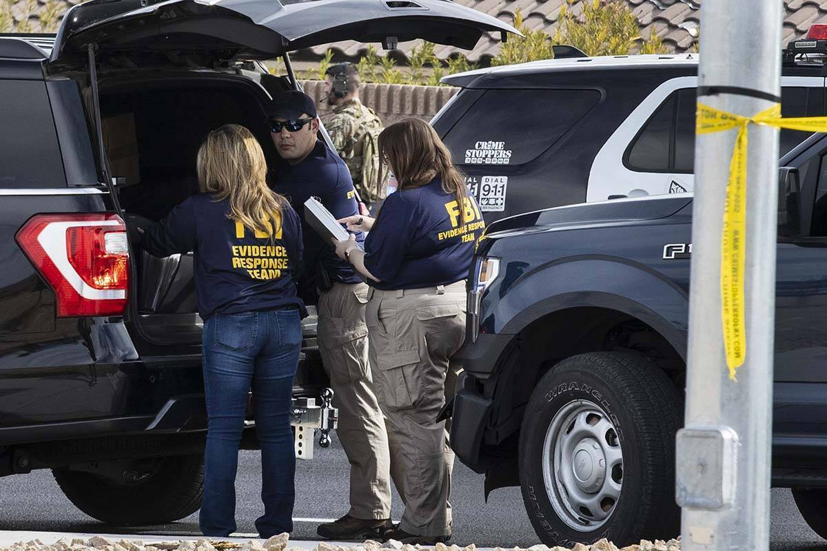 Las Vegas police and the FBI investigate a shooting on the 5400 block of Ruffian Road, near Wes ...
