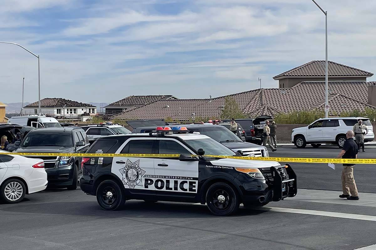 Las Vegas police and the FBI investigate a shooting on the 5000 block of Ruffian Road, near Wes ...