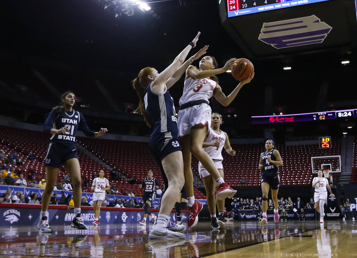 UNLV Lady Rebels guard Kiara Jackson (3) lays up the ball against Utah State Aggies guard Emmie ...