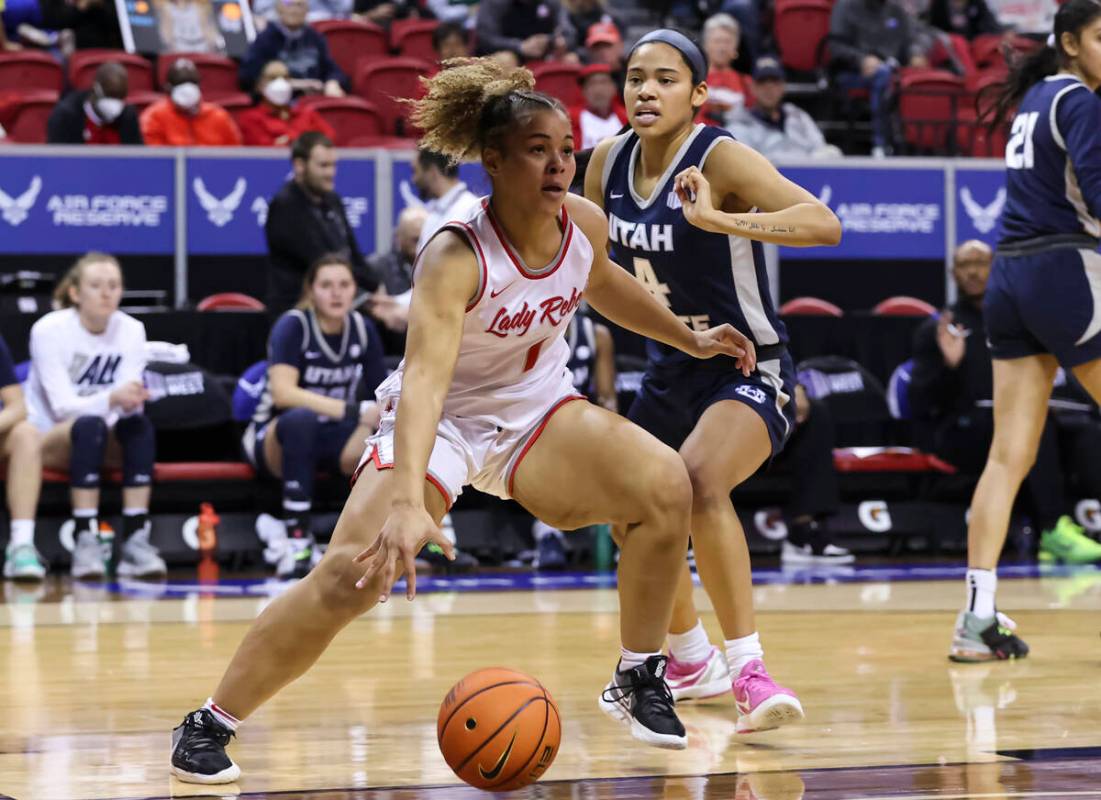 UNLV Lady Rebels forward Nneka Obiazor (1) drives to the basket against Utah State Aggies guard ...