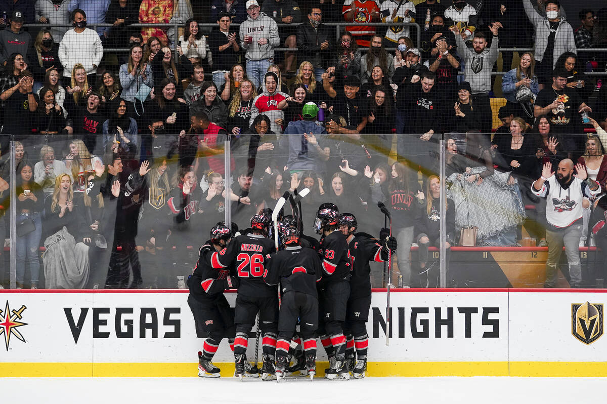 The UNLV hockey team celebrates in front of its fans after scoring a goal at City National Aren ...