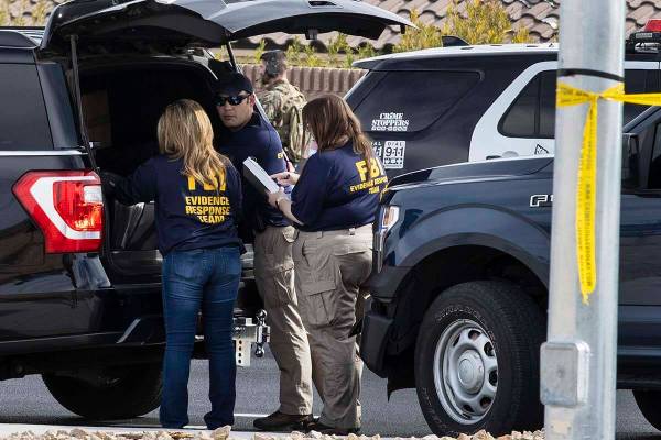 Las Vegas police assist the FBI in a barricade situation and shooting in northwest Las Vegas on ...